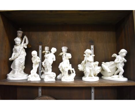 A collection of white glazed porcelain figures,&nbsp;to include a figural lamp, height excluding fitting 26.5cm.&nbsp; 