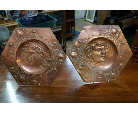 A pair of Art Nouveau embossed copper hexagonal plaques,&nbsp;37.5cm wide.&nbsp; 