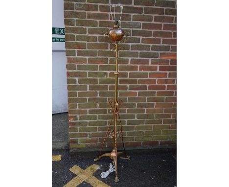 An Art Nouveau copper and brass adjustable standard oil lamp,&nbsp;(converted for electricity). 