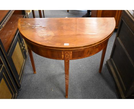 An antique mahogany and inlaid demi-lune card table,&nbsp;86cm wide, (alterations). 