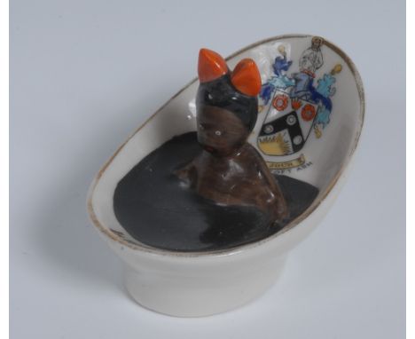 A Carlton China Crested Ware model, of a black girl wearing a red ribbon in a tin bath, inscribed Ise Making Ink, Borough of 