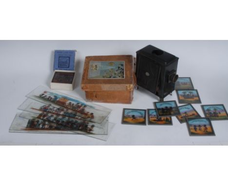 A German Magic Lantern, boxed;  a set of eight Primus Junior Lecturers Series Coloured Slides, Ten Ni**er Boys, boxed;  other