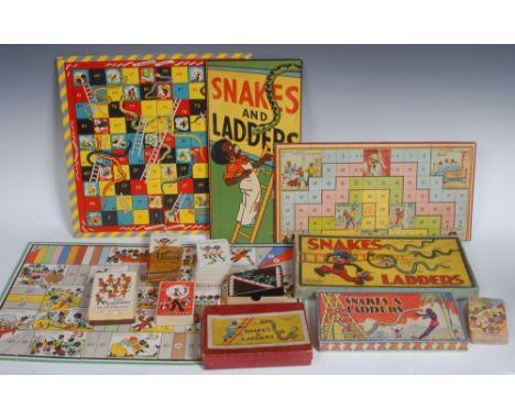 A mid 20th century Peter Pan Series Snakes and Ladders game, the card box printed in polychrome with a comical black boy purs