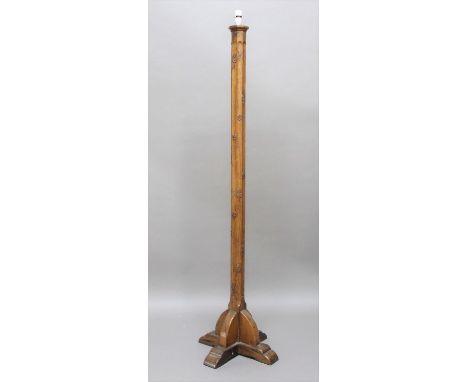 ARTS &amp; CRAFTS OAK STANDARD LAMP in the style of Mouseman, of octagonal shape with a fluted column and supported on 4 shap