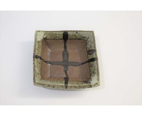 JANET LEACH (1918-1997) ST IVES DISH a small square stoneware dish with a mottled glaze around the rim, the interior with the
