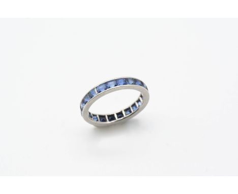 A SAPPHIRE FULL CIRCLE ETERNITY RING set with rectangular-shaped calibre-cut sapphires. Size M.