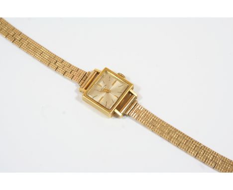 A LADY'S 18CT. GOLD WRISTWATCH BY FAVRE-LEUBA the signed rectangular-shaped dial with baton numerals, on a 9ct. gold bracelet