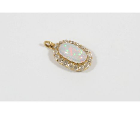 AN OPAL AND DIAMOND CLUSTER PENDANT the oval-shaped solid white opal is set within a surround of old brilliant-cut diamonds, 