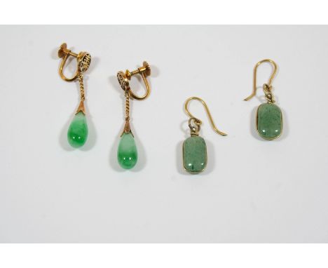 A PAIR OF JADE AND GOLD DROP EARRINGS each jade drop suspends from a gold surmount, with screw fittings, 4cm. long, together 