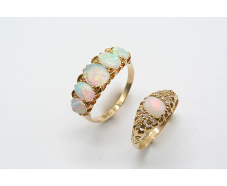 AN OPAL FIVE STONE RING the five graduated oval-shaped solid white opals are set in 18ct. gold, size R 1/2, together with an 