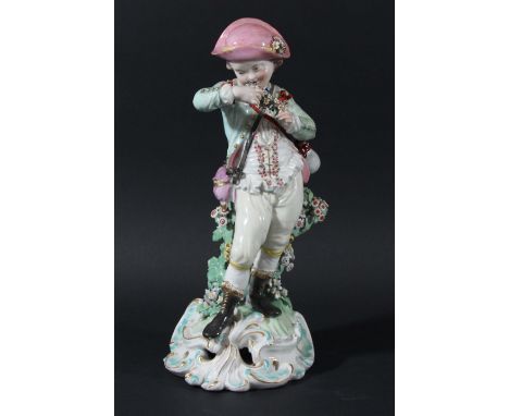 DERBY FIGURE OF A BOY, late 18th century, standing with a garland of flowers, on a pierced rococo base, patch marks, height 2