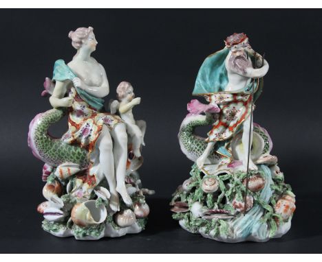NEPTUNE AND VENUS, a pair of Derby figures, late 18th century, he holding a trident and she with a cherub, on shell encrusted