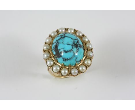 A TURQUOISE MATRIX AND PEARL CLUSTER RING the oval-shaped turquoise matrix is set within a surround of half pearls, in 9ct. g