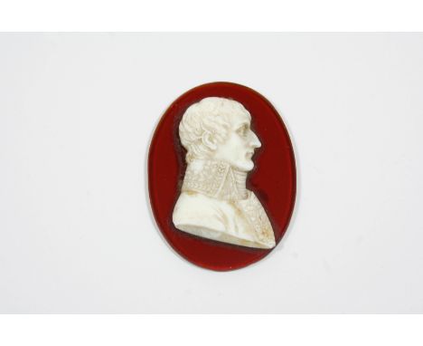 A WHITE GLASS PORTRAIT RELIEF MEDALLION depicting the head and shoulders of Napoleon Bonaparte, 4.5 x 3.5cm. 