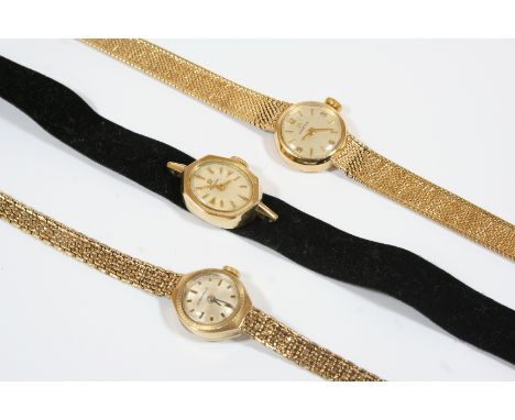 A LADY'S 9CT. GOLD WRISTWATCH BY OMEGA the signed circular dial with Arabic quarters and baton numerals, on an integral 9ct. 