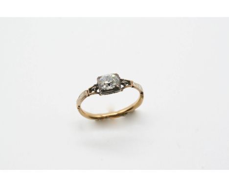 A GEORGE II ENAMEL AND DIAMOND MOURNING RING centred with a cushion-shaped diamond in gold closed back setting, with white en