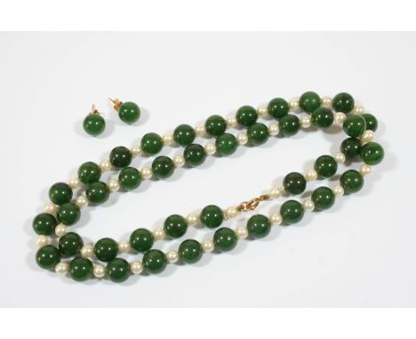 A JADE AND CULTURED PEARL NECKLACE formed alternately with green jade beads and cultured pearls, 60cm. long, together with a 