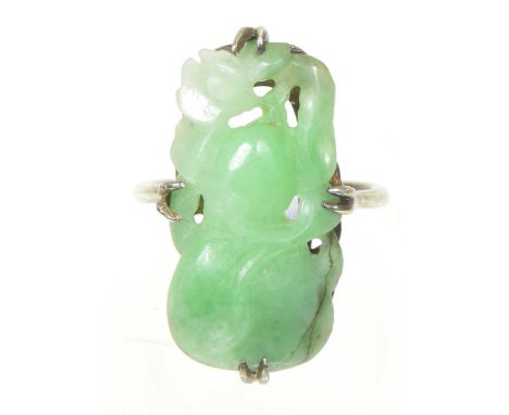 A jade dress ring
The carved and pierced jadeite panel depicting a gourd with floral accent, ring size L, AF, weight approx. 