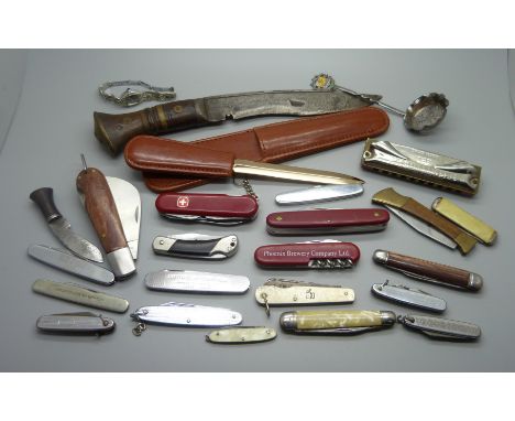 A collection of penknives, a letter opener, a harmonica, etc. 