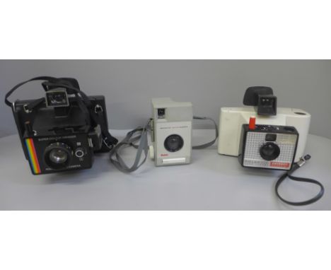 Two Polaroid Land cameras and a Kodak camera 