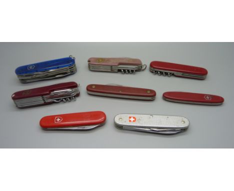 Eight pocket knives including two Swiss Victorinox 