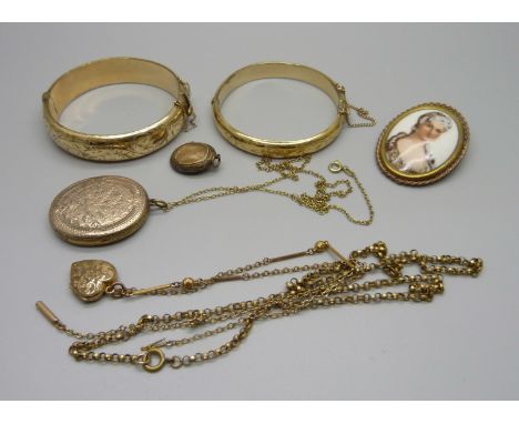 Jewellery including two rolled gold bangles, a portrait brooch, a locket, etc. 