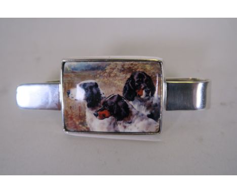 A silver 925 and enamel money clip with enamel plaque of gundogs 