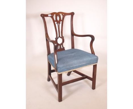 A late C18th/early C19th walnut Chippendale style elbow chair with carved and pierced splat back 