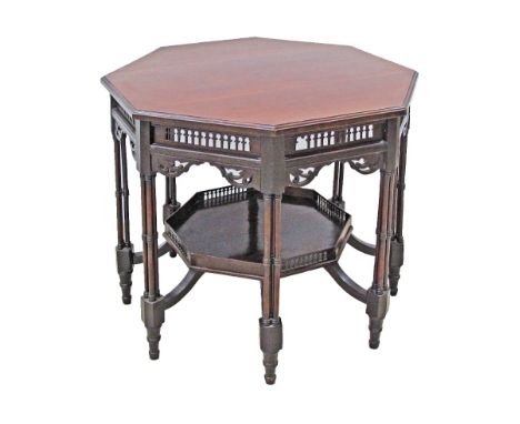 A Victorian mahogany octagonal center table, pierced frieze, on slender tapering legs joined by a galleried shelf stretcher, 
