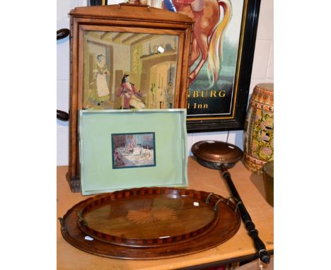 Two Victorian mahogany inlaid twin handled oval trays, another green painted tray, and a wool work tapestry fire screen (4)
