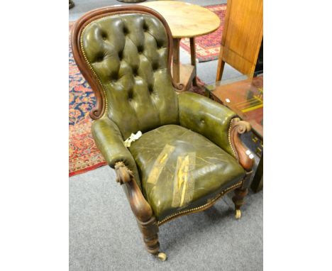 A Victorian carved mahogany upholstered button back chair 