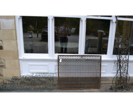A group of salvage including a wrought iron grille, large painted metal hinges, cast iron panels, a water feature basin, etc 