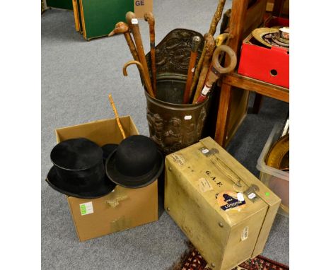 Bowler hats, silk top hat (a.f.), navy riding hat, boot pulls, white vellum suitcase, leather mounted crop, brass embossed st