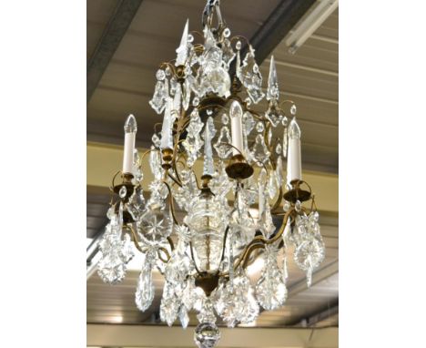 A six light lustre drop chandelier Condition overall appears to be good. Some possible losses to star shaped studs. 