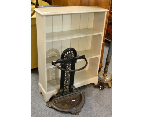 A cast iron stick stand, together with a painted pine three tier open bookcase