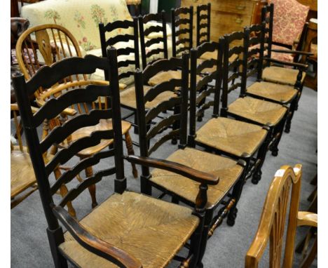 A set of ten Lancashire type rush seated ladder back dining chairs including a pair of carvers 
