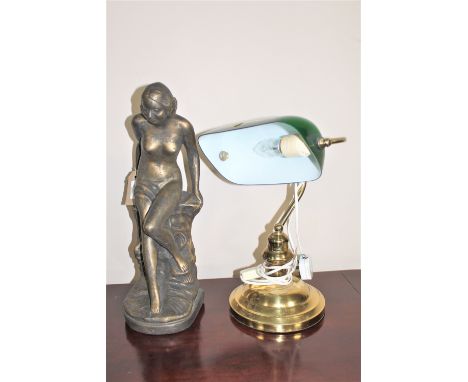 A brass banker's desk lamp and a gilt composition figure of a nude 