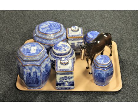 A tray containing seven Ringtons caddies, various, and a brown gloss Beswick horse