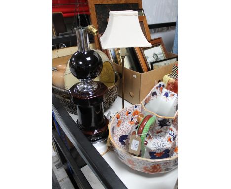 An ironstone jug and basin together with a wicker basket containing Art Deco glass shades and two tables