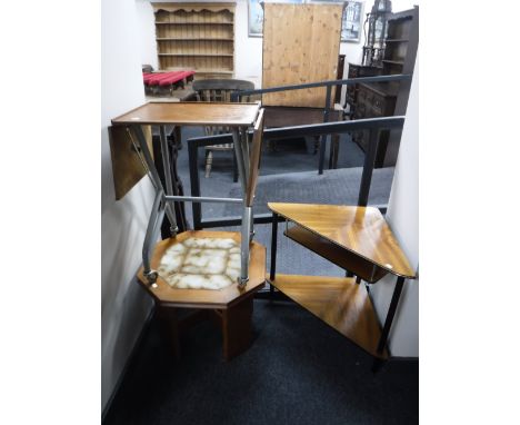 A teak two-tier corner magazine table together with an octagonal teak tile topped lamp table and a mid 20th century teak flap