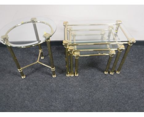 A nest of three brass and glass tables together with a matching brass and glass circular lamp table