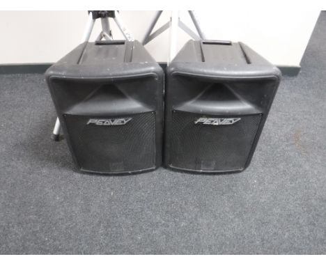 A pair of Peavey Impulse 200 PA speakers with tripod stands