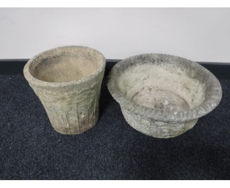 A stone plant pot together with a stone planter CONDITION REPORT: One measures 25cm high and 26cm in diameter. The other is 1