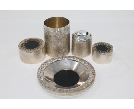 A silver gilt table lighter, Deakin and Francis, Birmingham 1978, in a textured bark finish with removable lid, together with