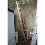 A wooden two section ladder.