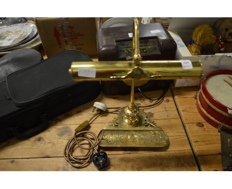 A brass desk lamp.