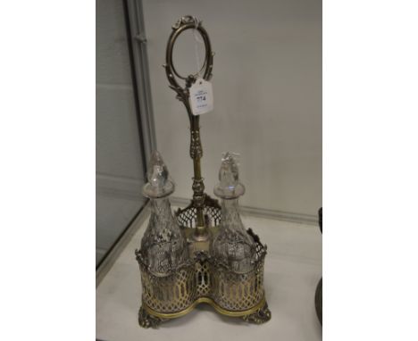 A plated triple decanter cruet containing a pair of cut glass decanters.