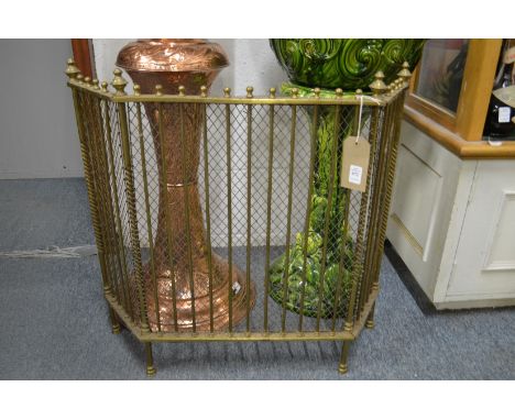 A brass folding fire screen.