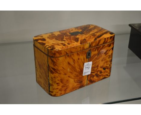 A Regency tortoiseshell two division tea caddy.