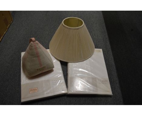 A door stop, pleated lamp shade and duvet covers.